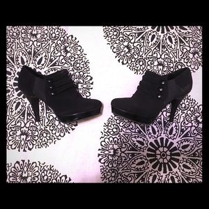 Black suede ankle booties with button detail